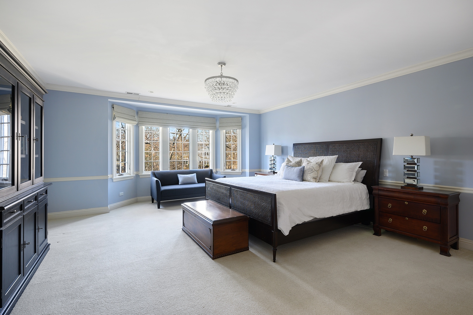 1435 Tower Road Winnetka, IL 60093 - Photo 22 of 34 a spacious bedroom with a bed and a couch