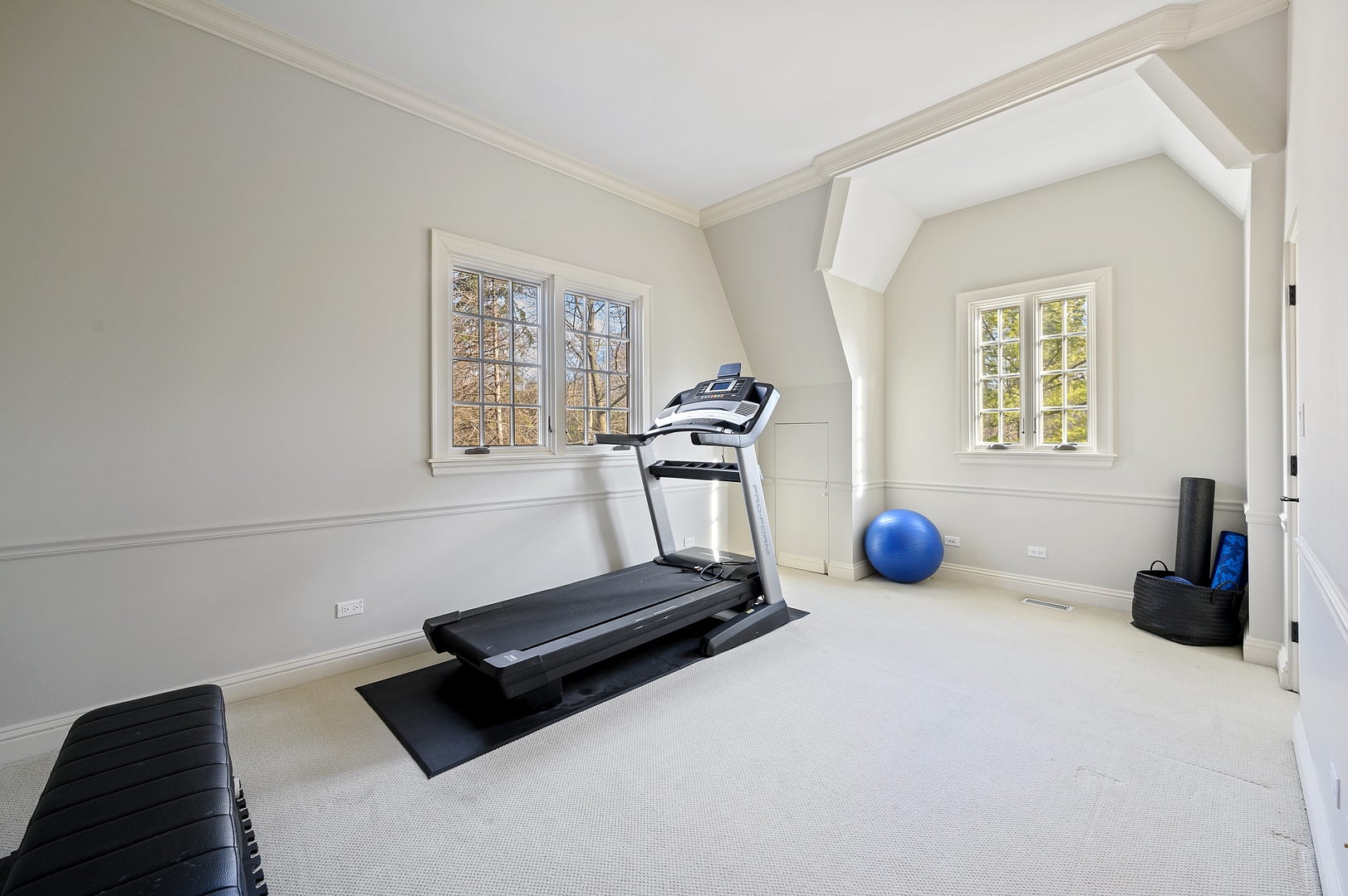 1435 Tower Road Winnetka, IL 60093 - Photo 24 of 34 a room with gym equipment and a window