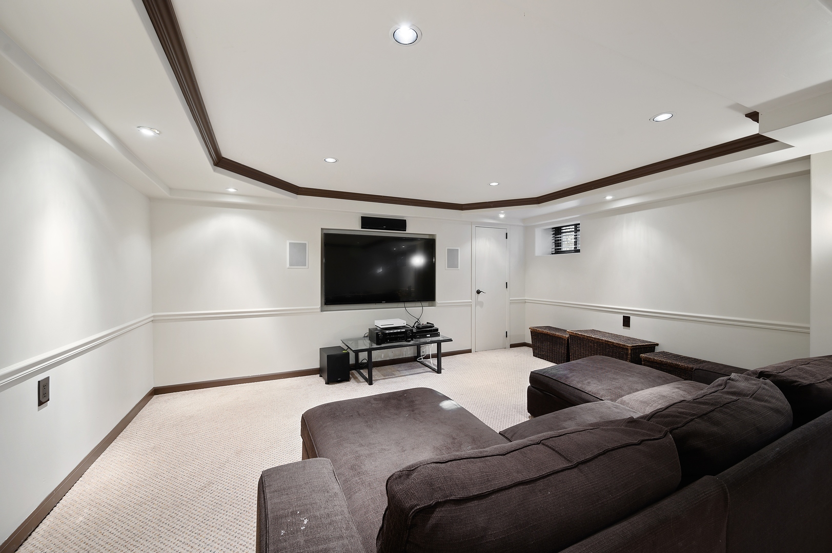 1435 Tower Road Winnetka, IL 60093 - Photo 32 of 34 a living room with furniture and a flat screen tv