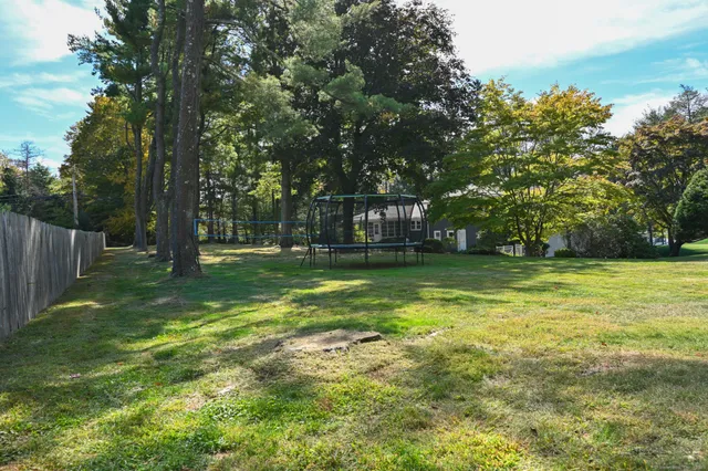 a backyard of a house with lots of green space