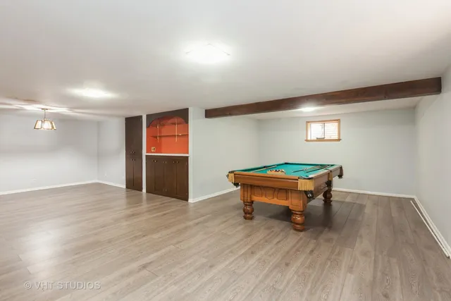 a room with wooden floor and furniture