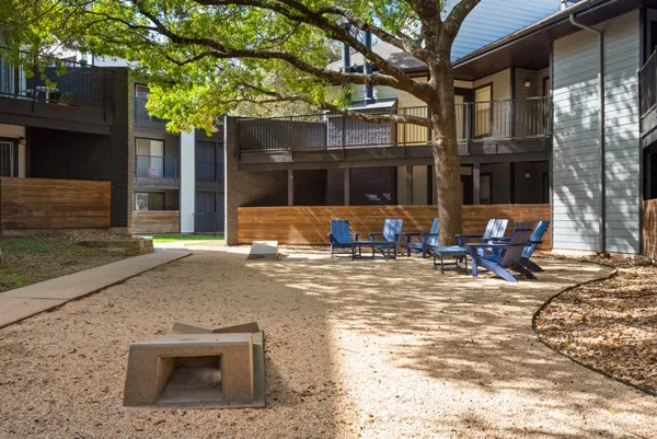 a view of a swimming pool with sitting area