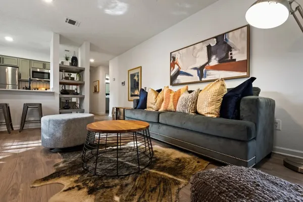 a living room with furniture and a rug