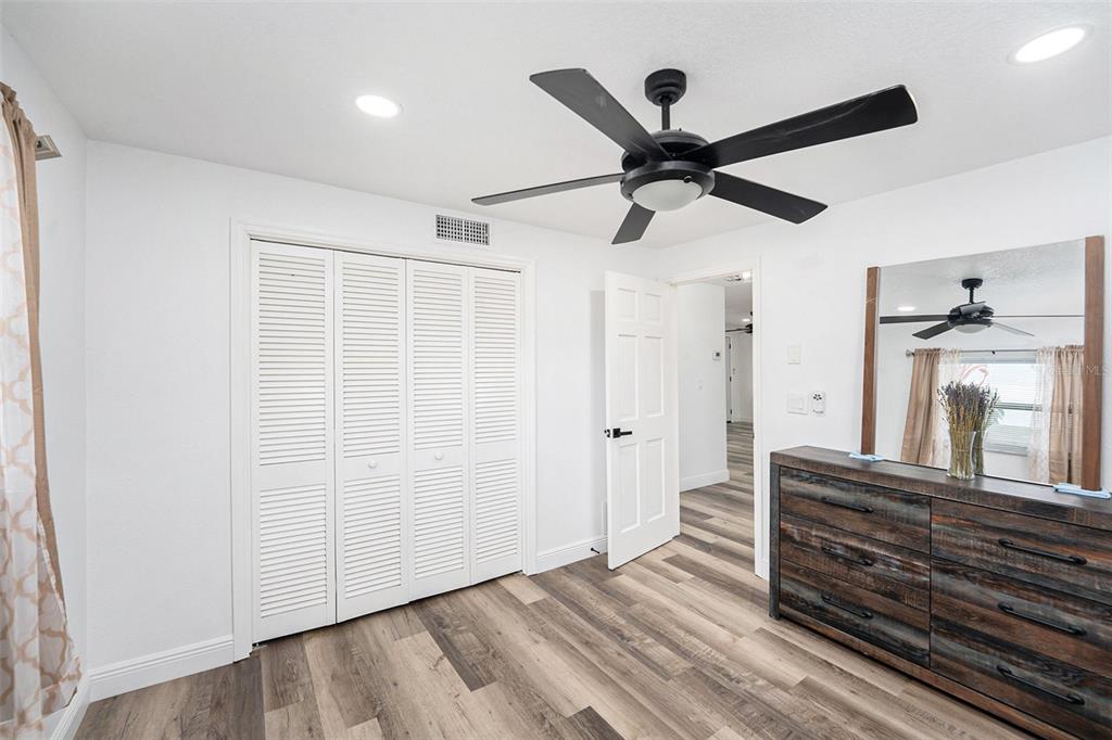 1806 North Keene Road Clearwater, FL 33755 - Photo 23 of 35 a view of a hallway with wooden floor and staircase