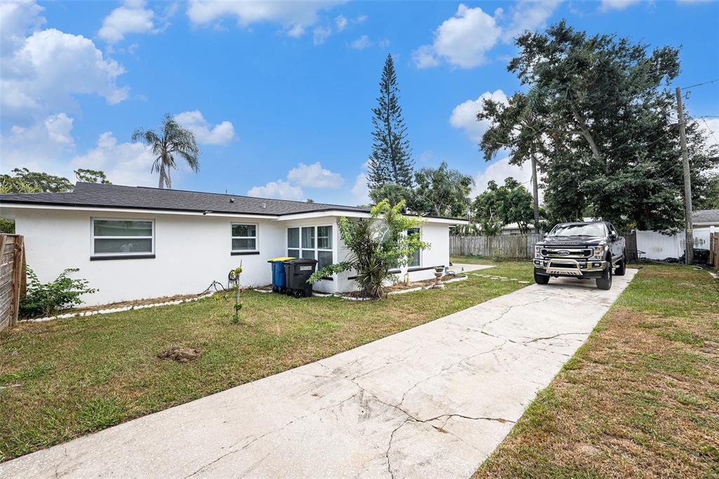 1806 North Keene Road Clearwater, FL 33755 - Photo 28 of 35 a view of a house with backyard and sitting area