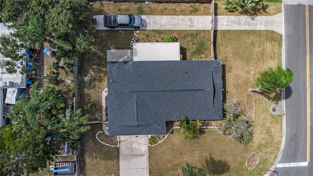 1806 North Keene Road Clearwater, FL 33755 - Photo 32 of 35 an aerial view of a house with a yard and large tree