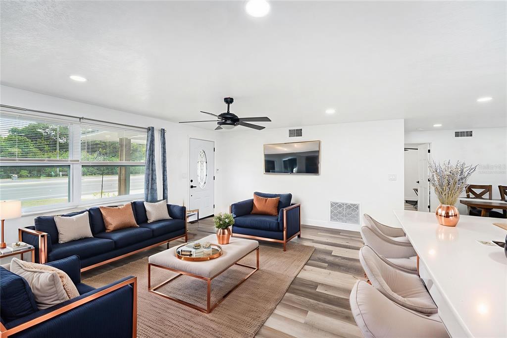 1806 North Keene Road Clearwater, FL 33755 - Photo 4 of 35 a living room with furniture and a large window