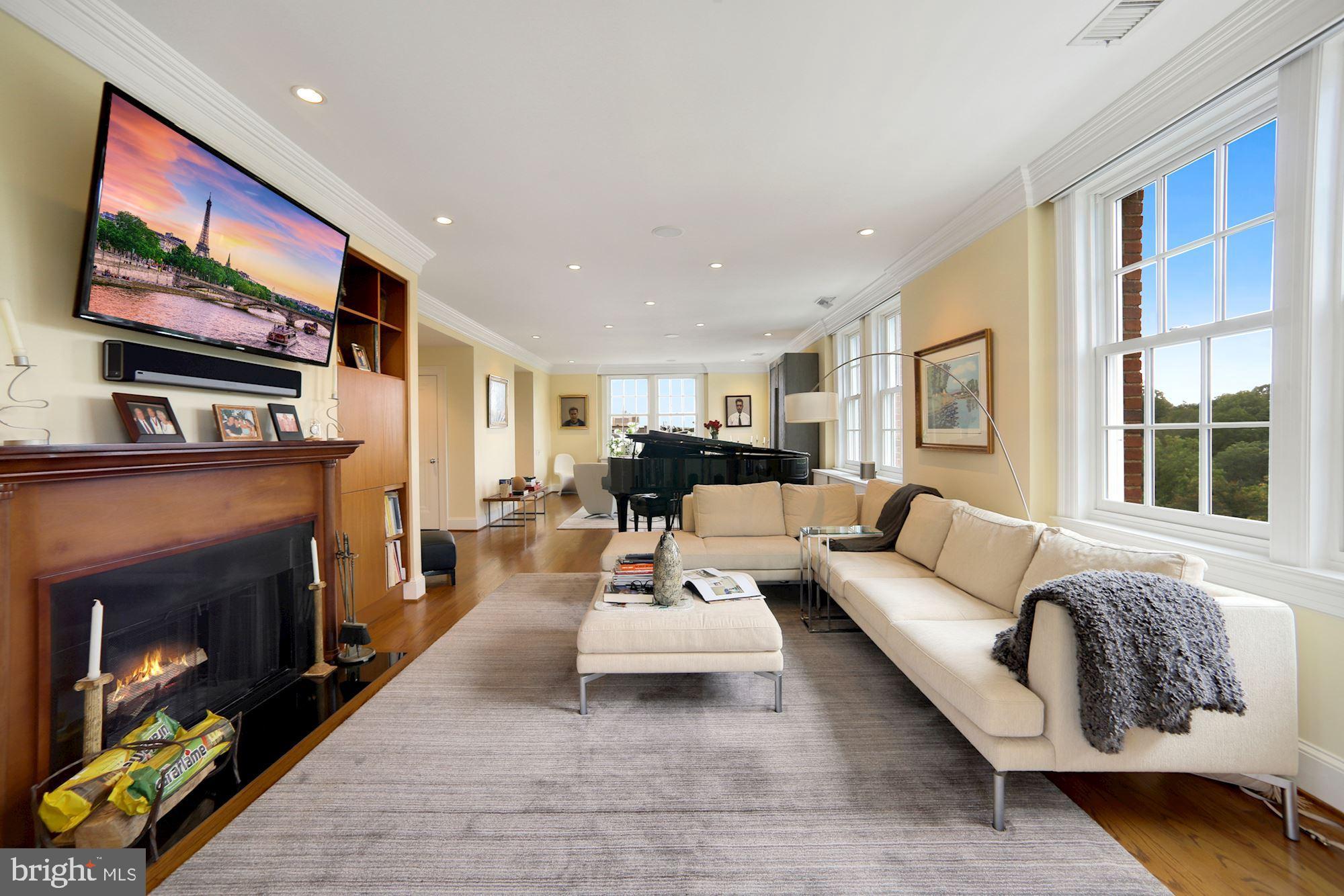 2540 Massachusetts Avenue Northwest, Unit 505 Washington, DC 20008 - Photo 13 of 32 Wood-burning fireplace warms the living space
