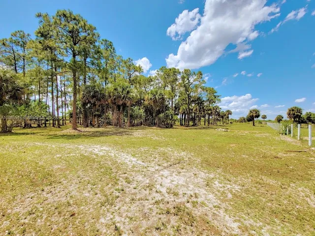 a view of swimming pool with an outdoor space and seating area