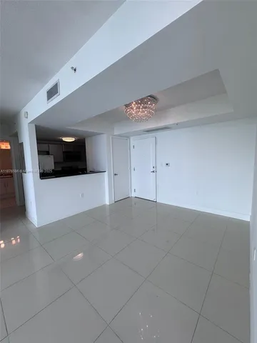 a stove top oven sitting inside of a kitchen