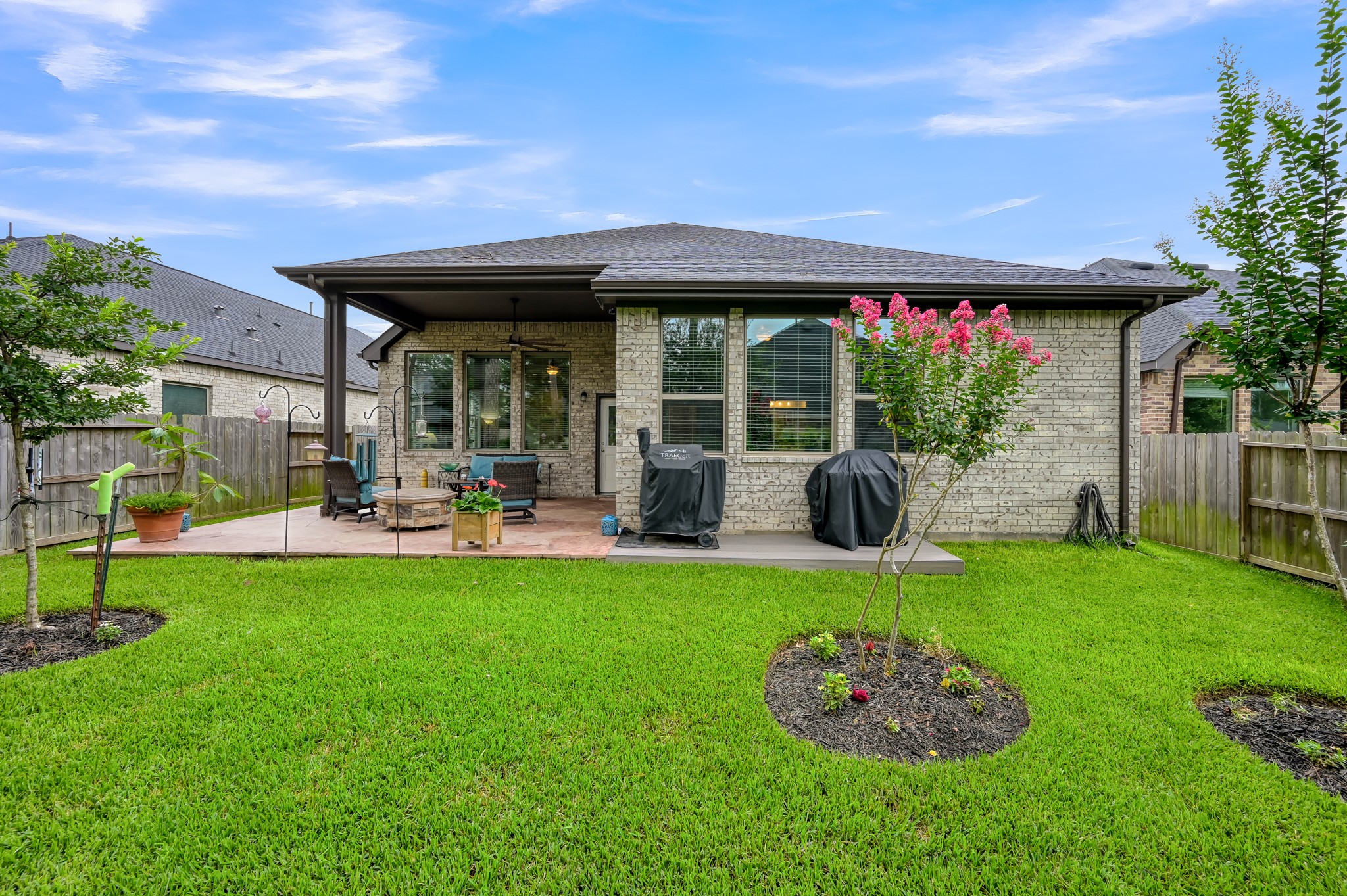 111 Yellow Perch Way Conroe, TX 77318 - Photo 22 of 35 Backyard view highlighting the home's inviting outdoor living areas.