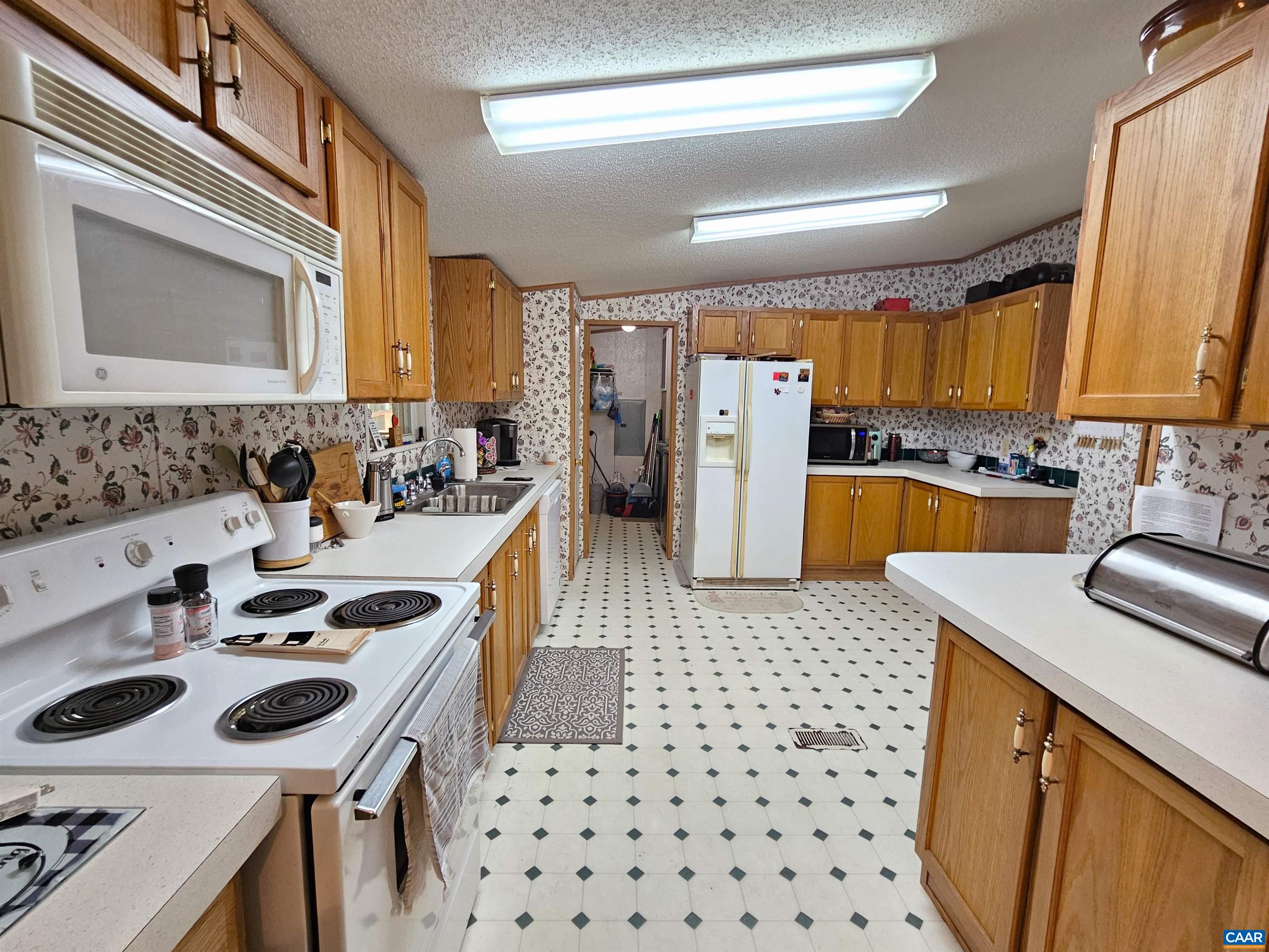981 Scotts Bottom Road Dillwyn, VA 23936 - Photo 12 of 62 a kitchen with a sink stove and refrigerator