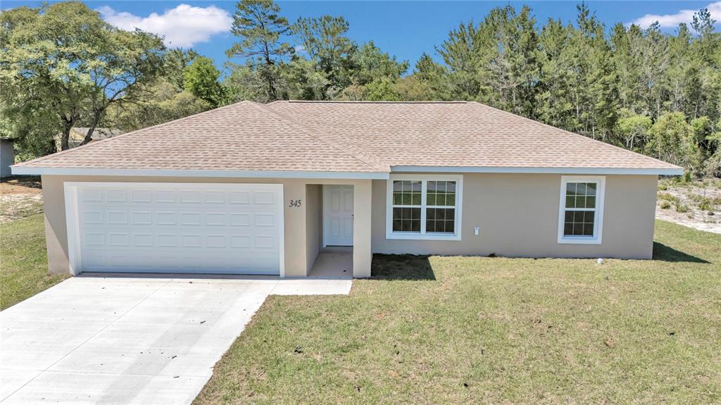 3914 Southwest 161st Loop Ocala, FL 34473 - Photo 1 of 1 a front view of a house with a garden and yard