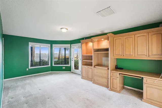 a kitchen with stainless steel appliances granite countertop a sink and cabinets