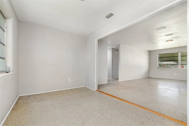 an empty room with windows