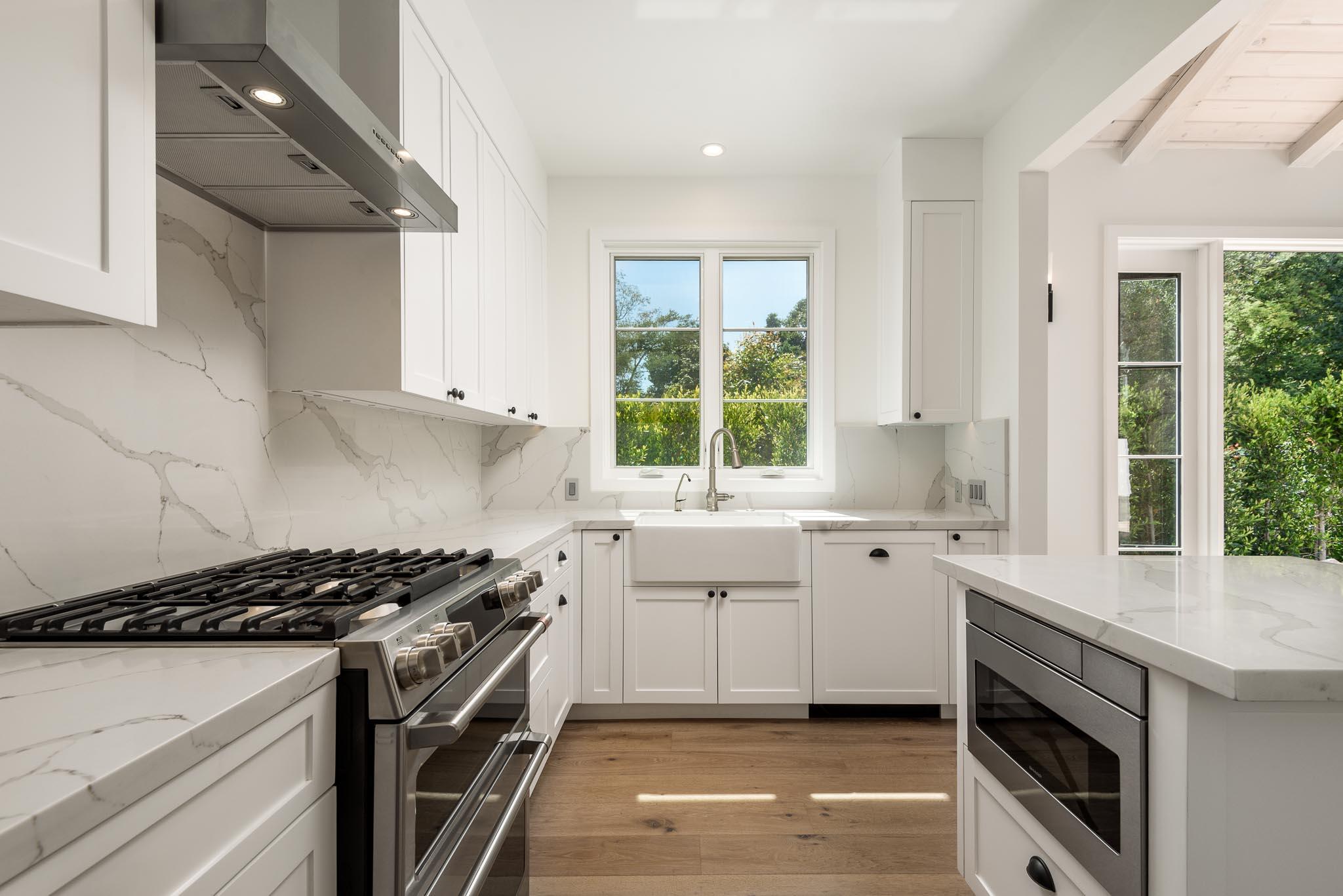 765 B Hot Springs Road Montecito, CA 93108 - Photo 11 of 33 a kitchen with a sink stove top oven and cabinets