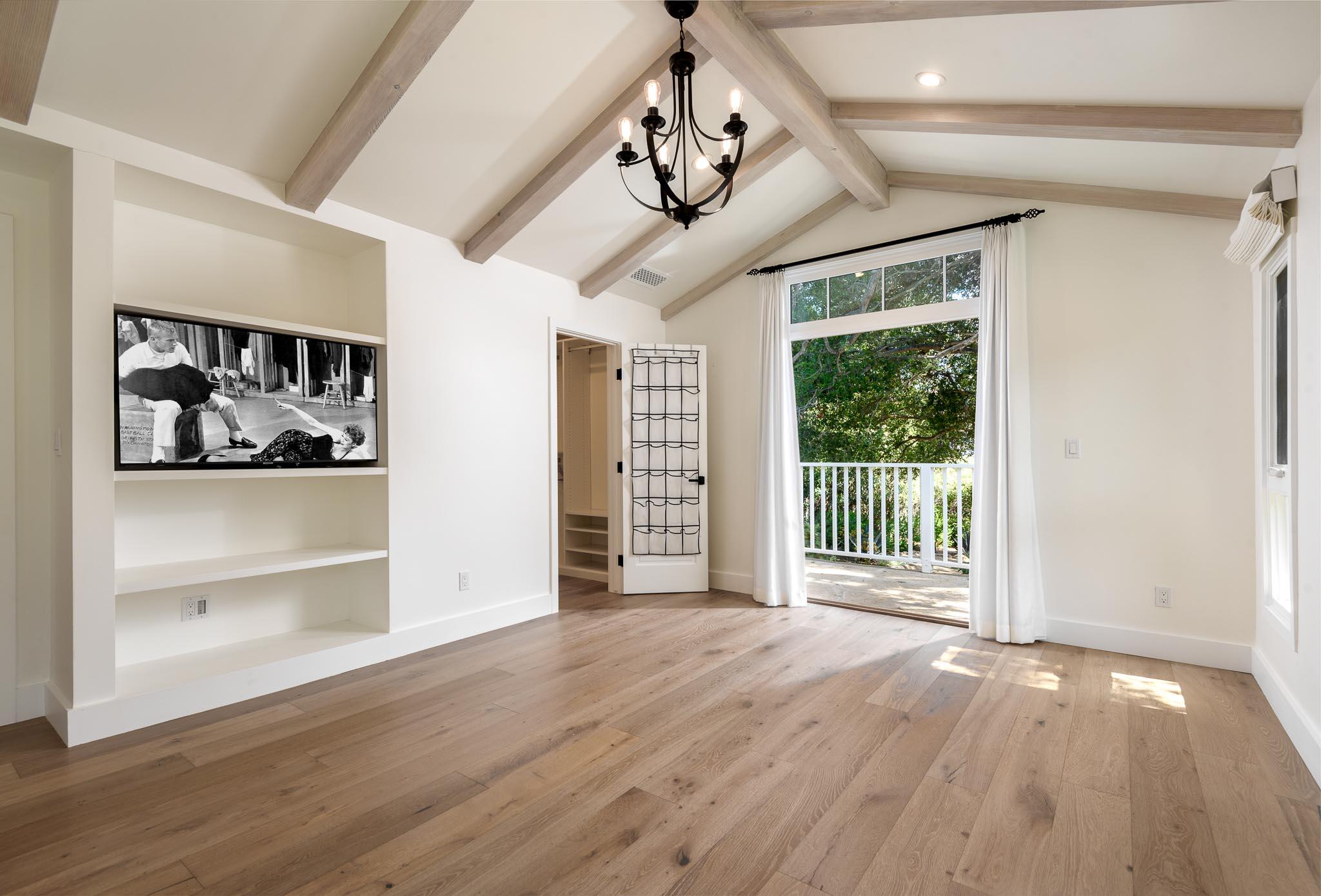 765 B Hot Springs Road Montecito, CA 93108 - Photo 15 of 33 a view of an empty room with a window and wooden floor