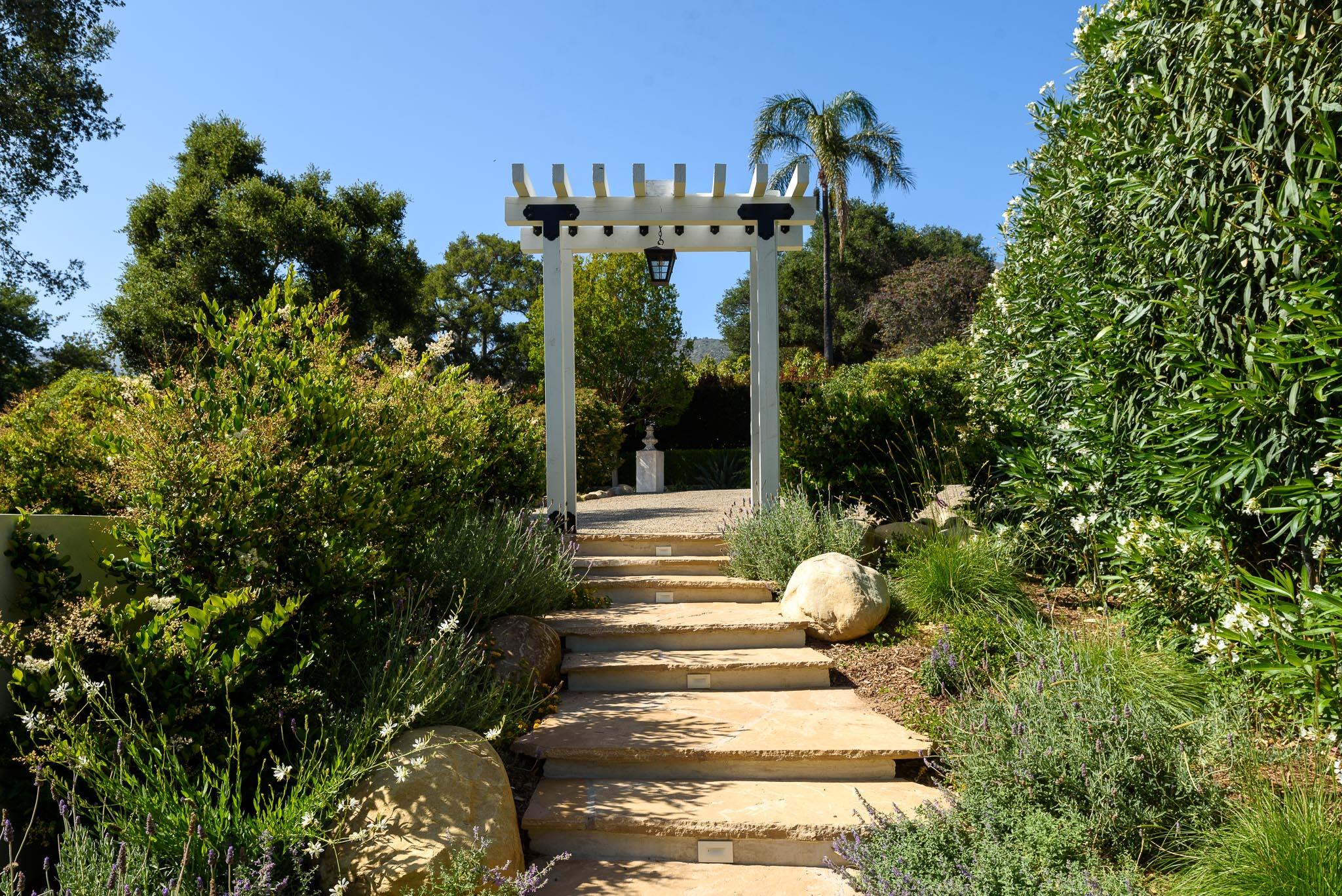 765 B Hot Springs Road Montecito, CA 93108 - Photo 33 of 33 a view of a house with a flower garden