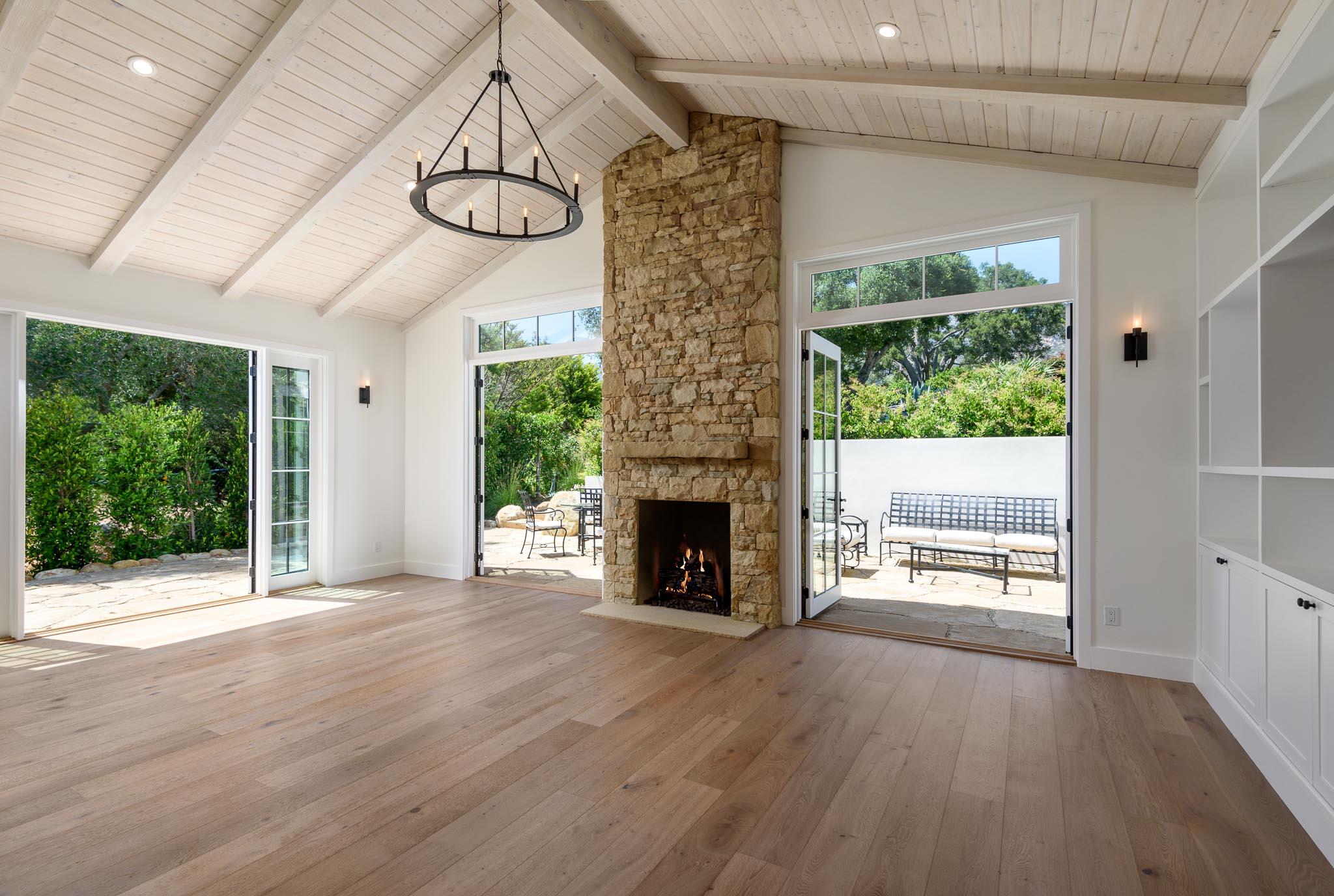 765 B Hot Springs Road Montecito, CA 93108 - Photo 5 of 33 a view of an empty room with wooden floor fireplace and a window