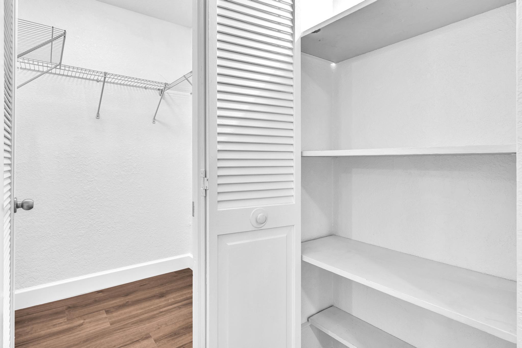 1291 Northwest 13th Street, Unit 445D Boca Raton, FL 33486 - Photo 37 of 50 a view of an empty walk in closet