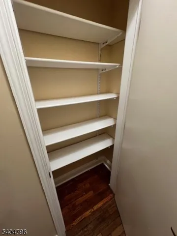 a living room with furniture a chandelier and a fireplace