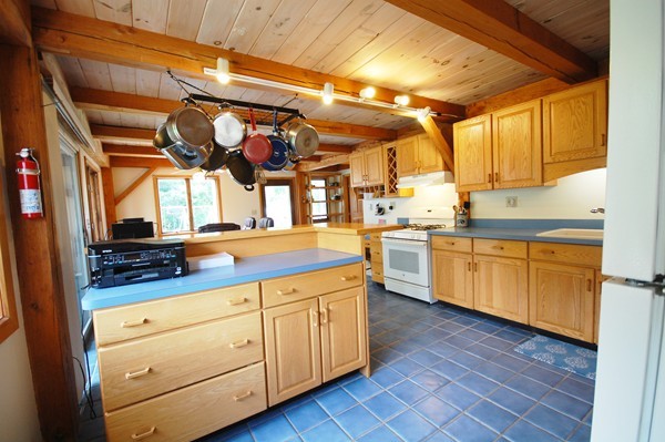 33 Osgood Road Sterling, MA 01564 - Photo 2 of 30 a kitchen that has a lot of cabinets in it and wooden floor