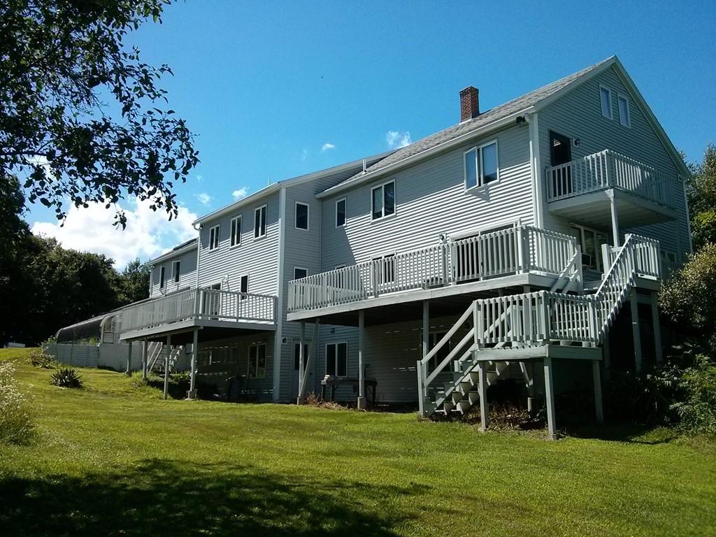 33 Osgood Road Sterling, MA 01564 - Photo 29 of 30 a view of a big house with a big yard and large trees