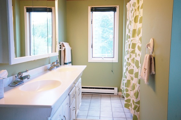 33 Osgood Road Sterling, MA 01564 - Photo 10 of 30 a bathroom with a sink a toilet and a window