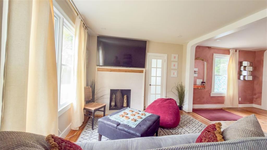 1450 Hawthorne Way East Point, GA 30344 - Photo 12 of 16 a living room with furniture and a fireplace