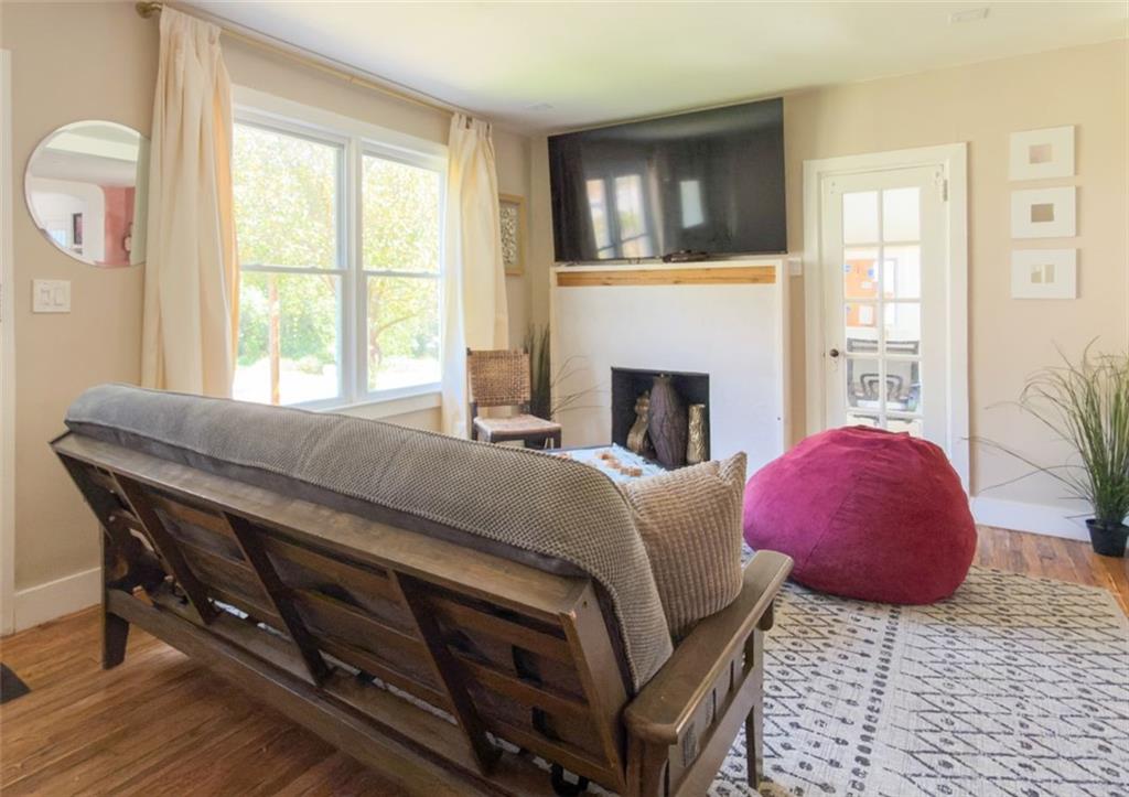 1450 Hawthorne Way East Point, GA 30344 - Photo 4 of 16 a living room with furniture and a fireplace