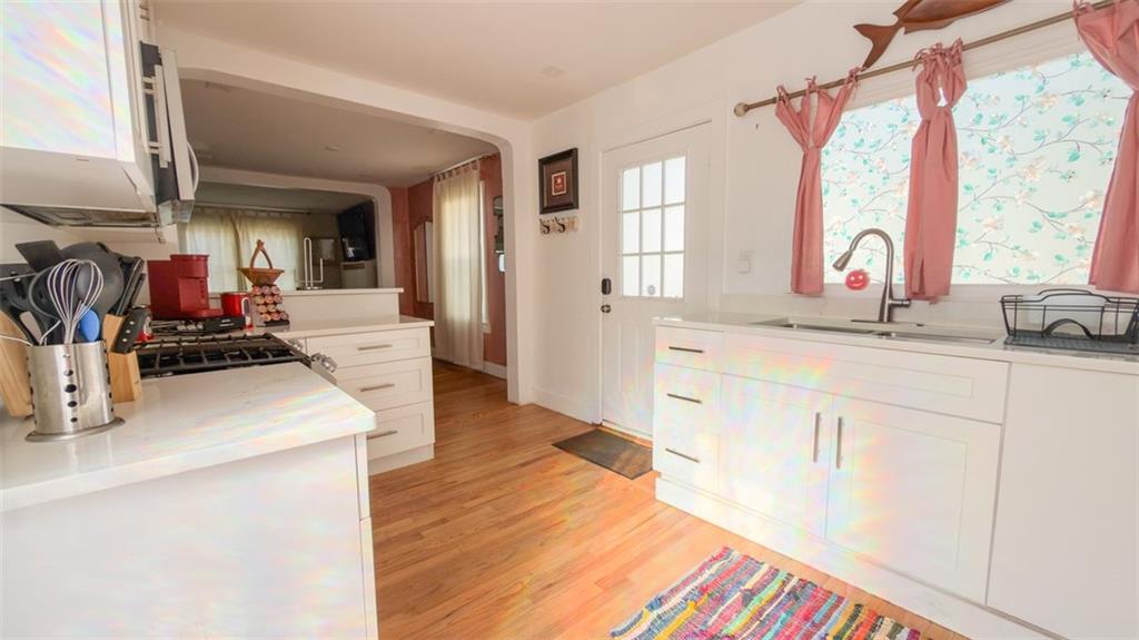 1450 Hawthorne Way East Point, GA 30344 - Photo 7 of 16 a kitchen with stainless steel appliances granite countertop a sink a stove and a refrigerator