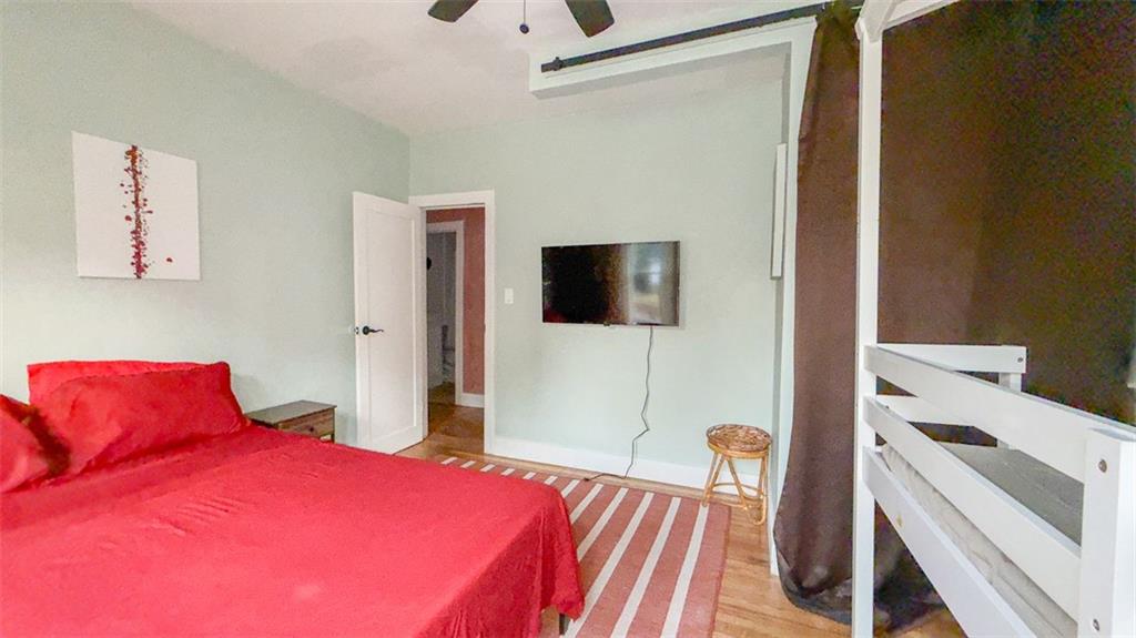 1450 Hawthorne Way East Point, GA 30344 - Photo 9 of 16 a bedroom with a bed and a flat screen tv