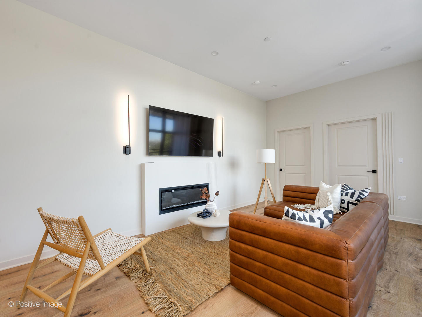 11 West Prospect Avenue, Unit 411 Mount Prospect, IL 60056 - Photo 16 of 71 a living room with furniture and a flat screen tv