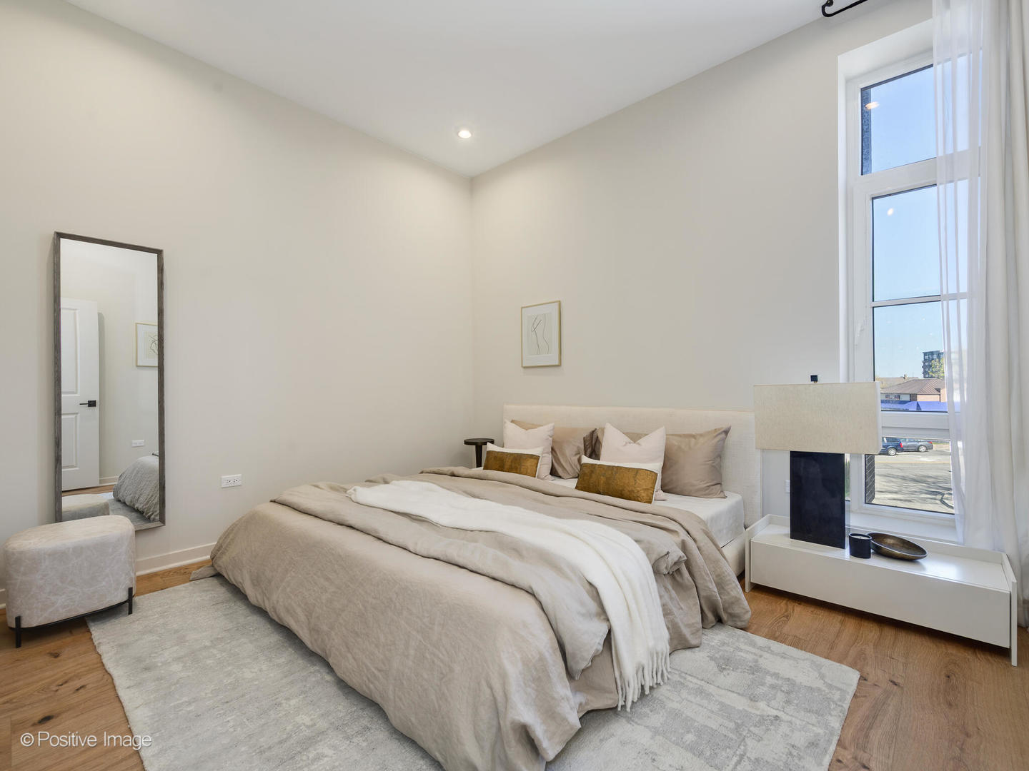 11 West Prospect Avenue, Unit 411 Mount Prospect, IL 60056 - Photo 19 of 71 a bedroom with a bed and a couch