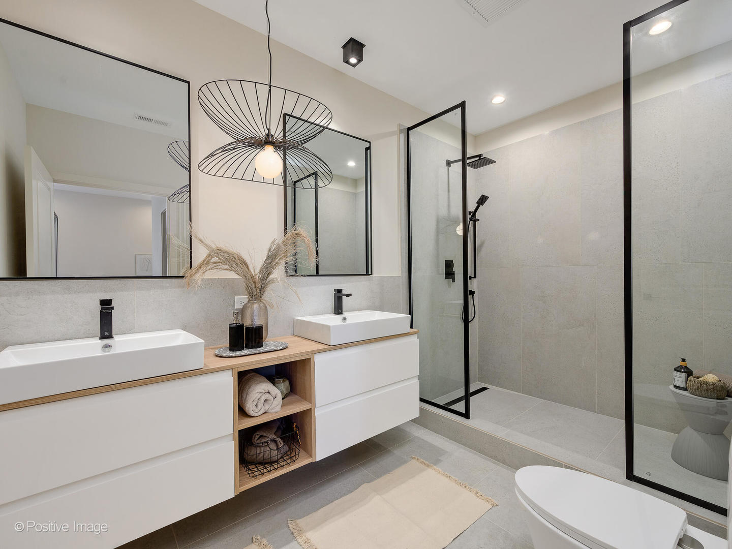 11 West Prospect Avenue, Unit 411 Mount Prospect, IL 60056 - Photo 22 of 71 a bathroom with a sink a toilet and shower