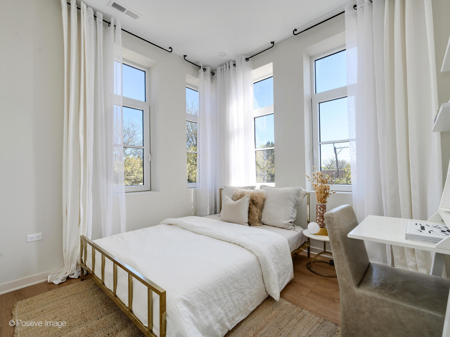 11 West Prospect Avenue, Unit 411 Mount Prospect, IL 60056 - Photo 23 of 71 a bedroom with a bed and a table