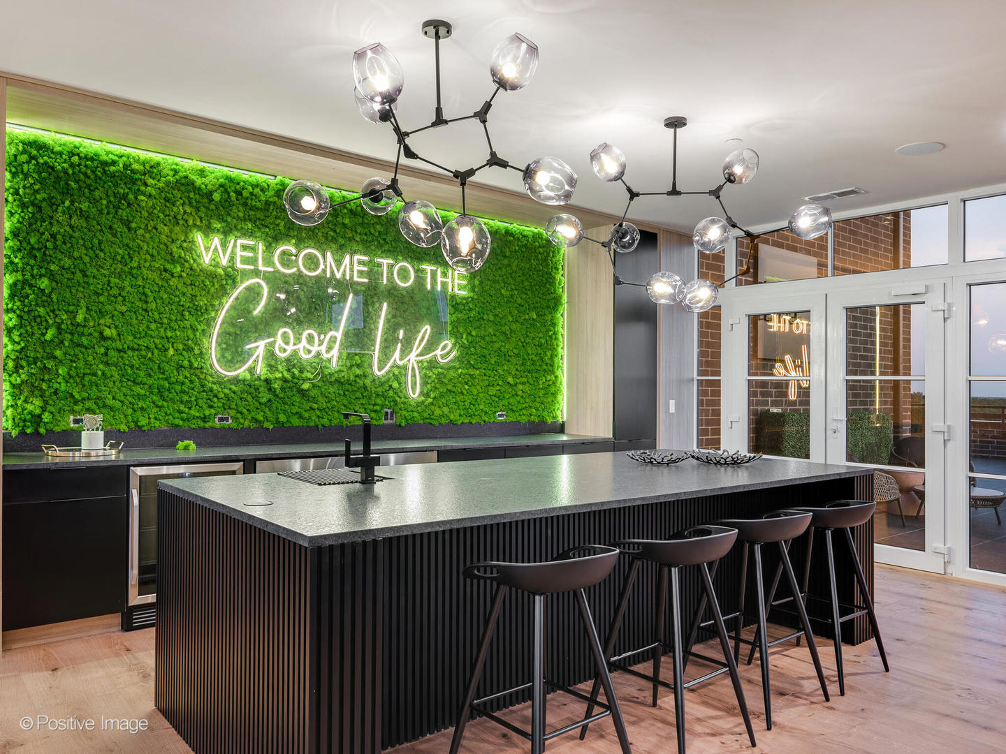 11 West Prospect Avenue, Unit 411 Mount Prospect, IL 60056 - Photo 45 of 71 a kitchen with a table chairs and chandelier