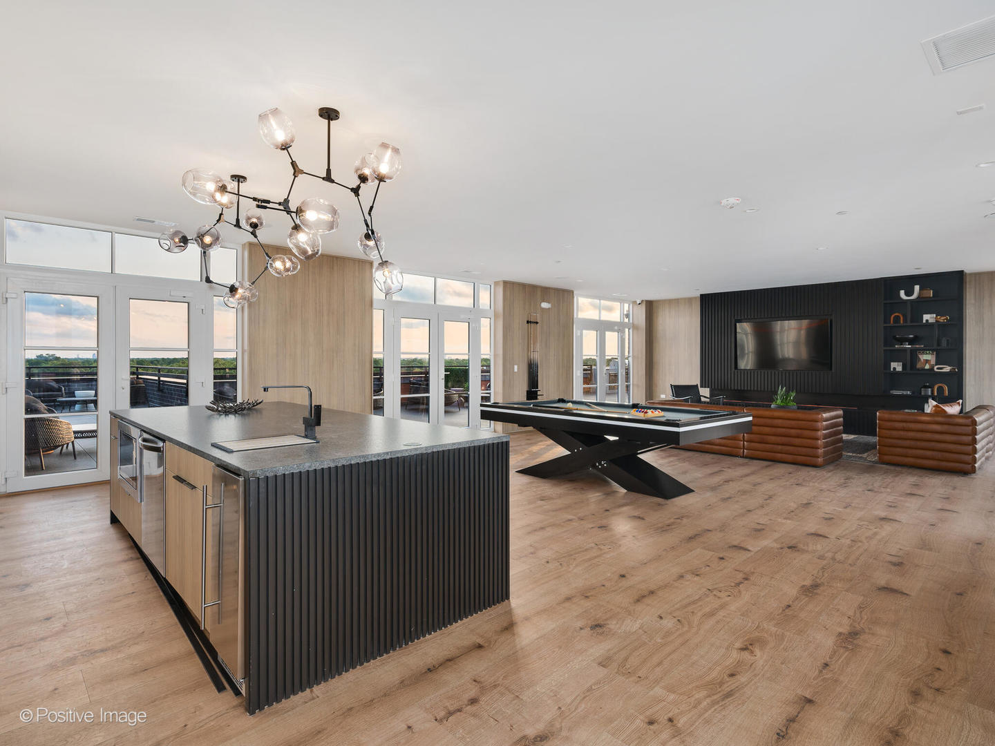 11 West Prospect Avenue, Unit 411 Mount Prospect, IL 60056 - Photo 47 of 71 a large kitchen with granite countertop a lot of cabinets a sink and a stove