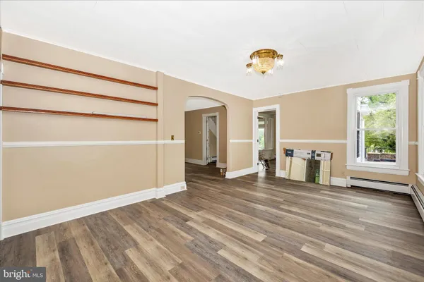 a bathroom with a toilet a sink and a mirror