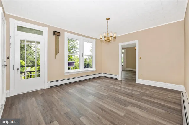 a bathroom with a toilet a sink and a mirror