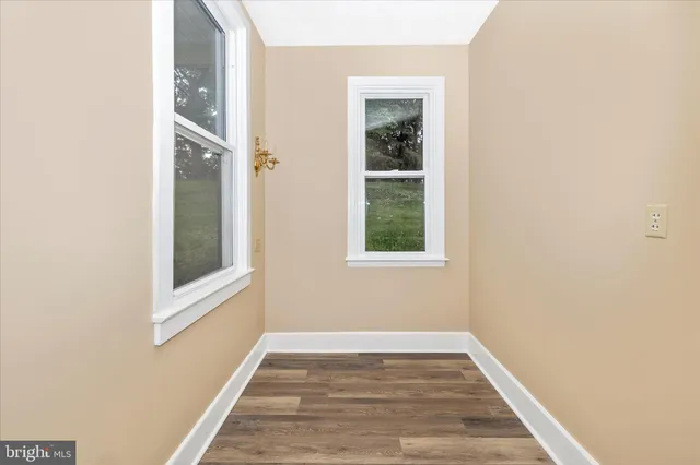 a front view of a house with a yard and a garage