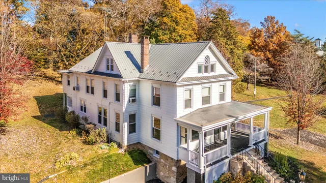 a view of an entryway with wooden floor and stairs