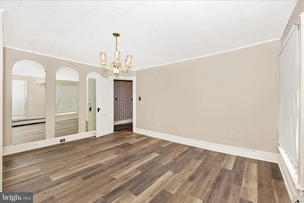 a view of a room with wooden walls