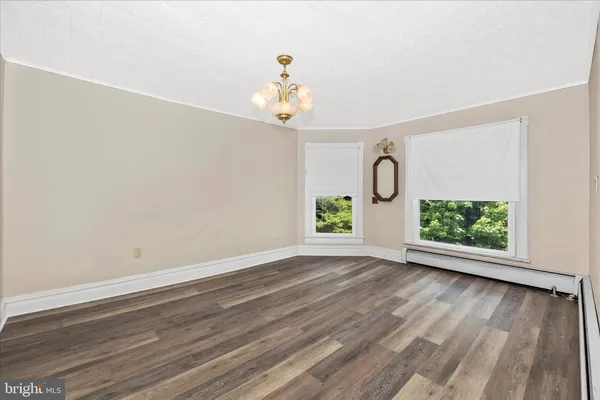 a view of an empty room with windows