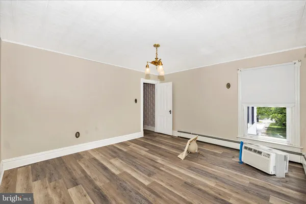 a view of empty room with wooden ceiling