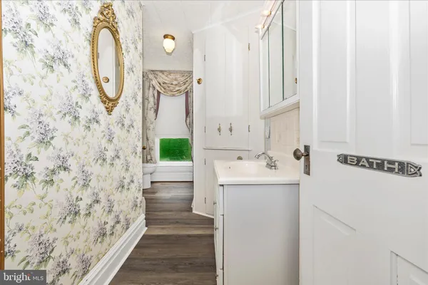 a front view of house with yard and trees