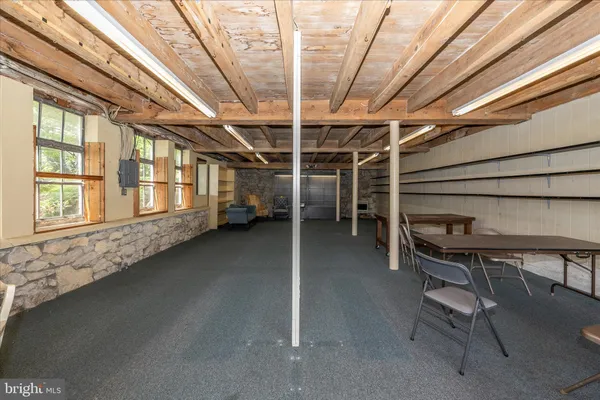 an aerial view of residential houses with outdoor space and river