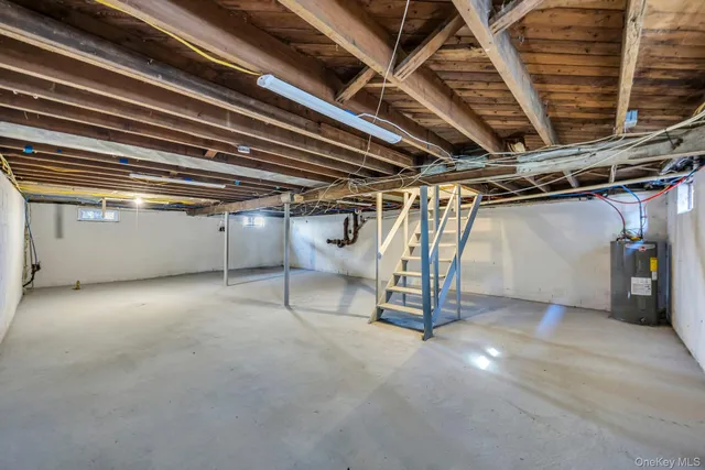 a view of an empty room with wooden walls