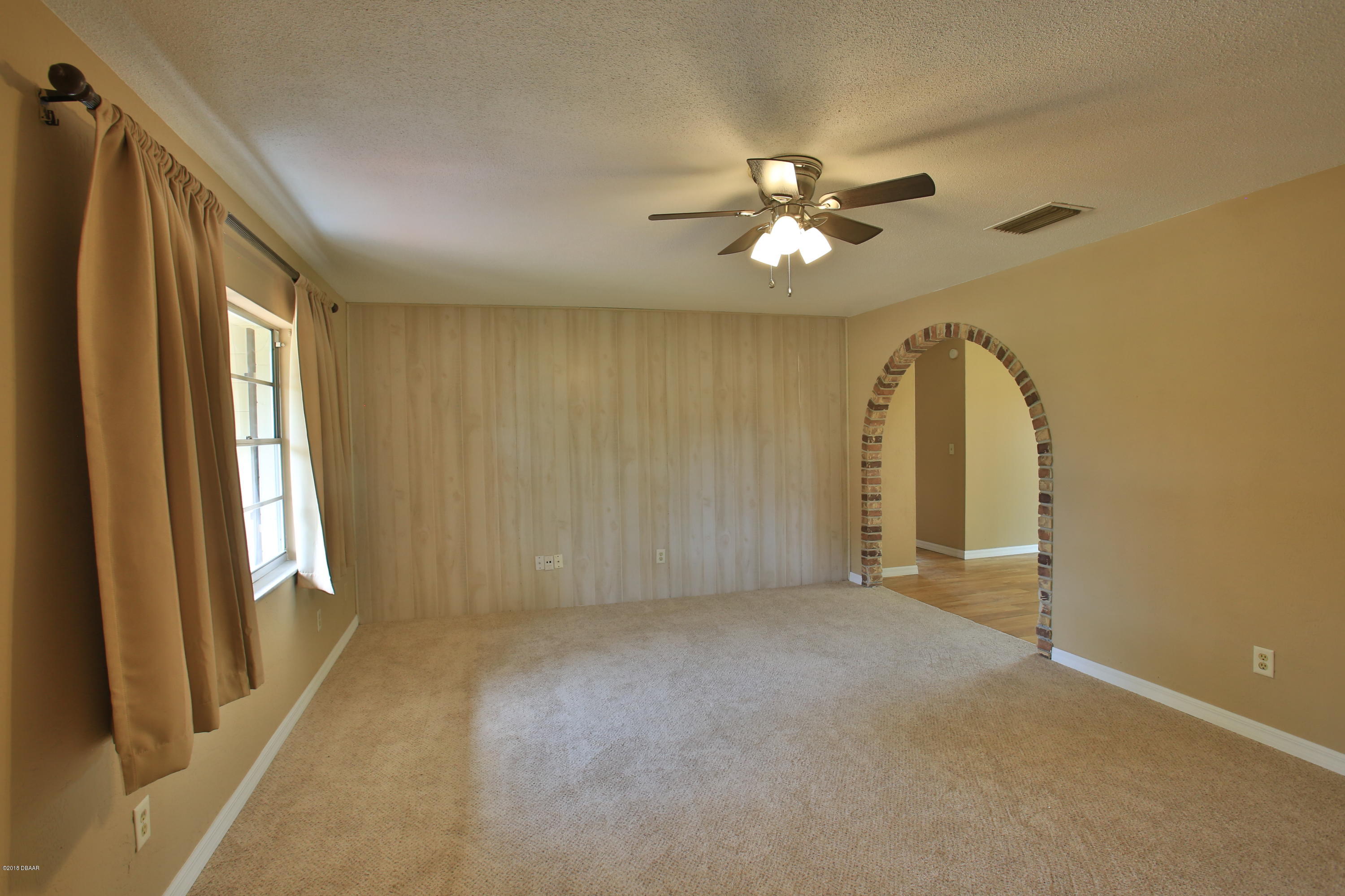22 Raintree Drive Port Orange, FL 32127 - Photo 3 of 17 Living room from front door