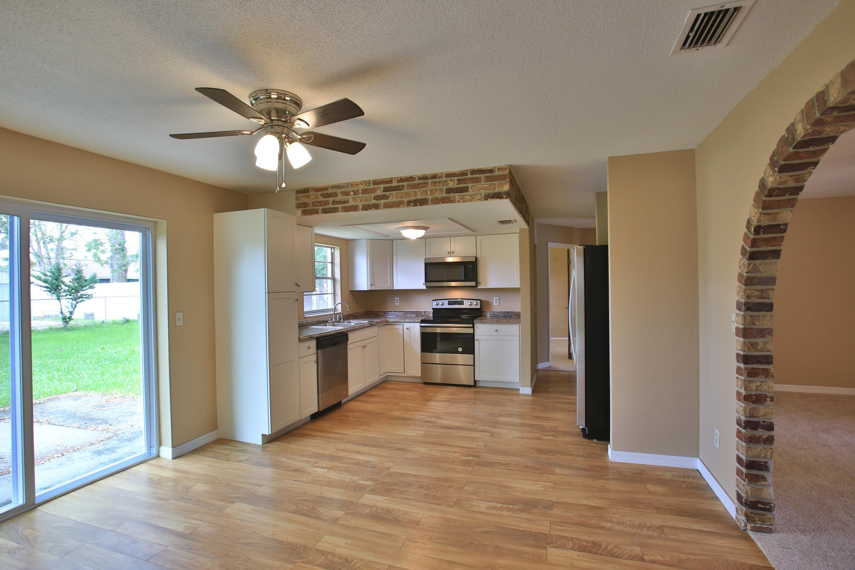 22 Raintree Drive Port Orange, FL 32127 - Photo 7 of 17 Dining open to kitchen